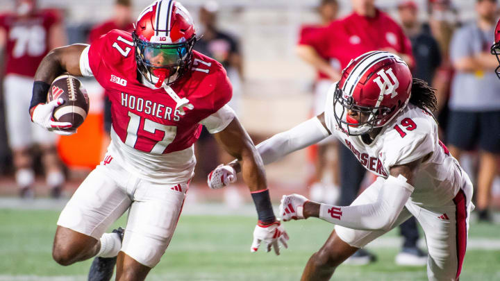 Indiana's Ty Son Lawton (17) runs the ball during the Indiana football spring game at Memorial Stadium on Thursday, April 18, 2024.