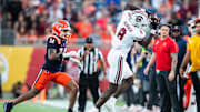 Dec 31, 2024; Orlando, FL, USA; South Carolina Gamecocks wide receiver Nyck Harbor (8) makes the catch over Illinois Fighting Illini defensive back Xavier Scott (14) in the third quarter at Camping World Stadium. Mandatory Credit: Jeremy Reper-Imagn Images