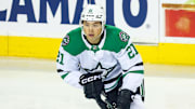 Mar 27, 2025; Calgary, Alberta, CAN; Dallas Stars left wing Jason Robertson (21) skates during the warmup period against the Calgary Flames at Scotiabank Saddledome. Mandatory Credit: Sergei Belski-Imagn Images