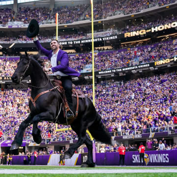 Oct 30, 2022; Minneapolis, Minnesota, USA; Minnesota Vikings Jared Allen (69) rides in on a horse before his induction into the Ring of Honor against the Arizona Cardinals at half time at U.S. Bank Stadium. Mandatory Credit: Brad Rempel-USA TODAY Sports