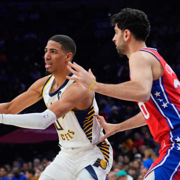 Apr 9, 2022; Philadelphia, Pennsylvania, USA; Indiana Pacers point guard Tyrese Haliburton (0) passes the ball against Philadelphia 76ers shooting guard Furkan Korkmaz (30) during the first half at Wells Fargo Center. Mandatory Credit: Gregory Fisher-USA TODAY Sports