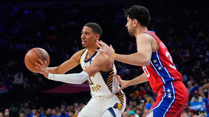 Apr 9, 2022; Philadelphia, Pennsylvania, USA; Indiana Pacers point guard Tyrese Haliburton (0) passes the ball against Philadelphia 76ers shooting guard Furkan Korkmaz (30) during the first half at Wells Fargo Center. Mandatory Credit: Gregory Fisher-USA TODAY Sports