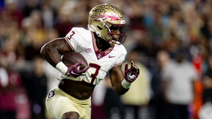 Florida State Seminoles running back Trey Benson (3) rushes with the ball during the first half against the Florida Gators at Steve Spurrier Field at Ben Hill Griffin Stadium in Gainesville, FL on Saturday, November 25, 2023. [Matt Pendleton/Gainesville Sun]