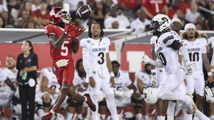 Houston Cougars wide receiver Stephon Johnson (5) makes a reception as Colorado Buffaloes cornerback Makari Vickers (10) defends during the fourth quarter at TDECU Stadium.