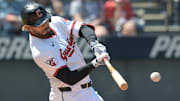 Apr 23, 2025; Cleveland, Ohio, USA; Cleveland Guardians second baseman Gabriel Arias (13) hits a double during the first inning against the New York Yankees at Progressive Field. Mandatory Credit: Ken Blaze-Imagn Images