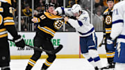Jan 14, 2025; Boston, Massachusetts, USA; Boston Bruins center Trent Frederic (11) and Tampa Bay Lightning defenseman Emil Lilleberg (78) fight during the second period at the TD Garden. Mandatory Credit: Brian Fluharty-Imagn Images