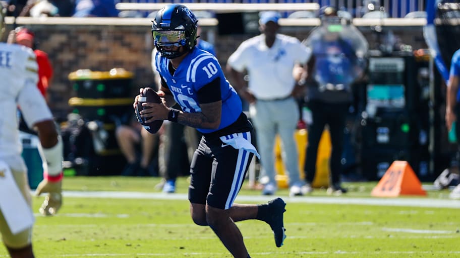 Duke Blue Devils quarterback Darian Mensah runs with the ball