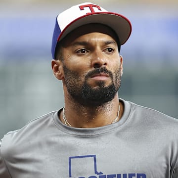 Jul 11, 2025; Houston, Texas, USA; Texas Rangers second baseman Marcus Semien (2) wears a Together for Texas shirt in support of Texas flood victims before the game against the Houston Astros at Daikin Park