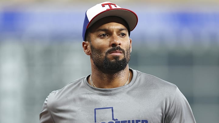 Jul 11, 2025; Houston, Texas, USA; Texas Rangers second baseman Marcus Semien (2) wears a Together for Texas shirt in support of Texas flood victims before the game against the Houston Astros at Daikin Park Jul 11, 2025; Houston, Texas, USA; Texas Rangers second baseman Marcus Semien (2) wears a Together for Texas shirt in support of Texas flood victims before the game against the Houston Astros at Daikin Park