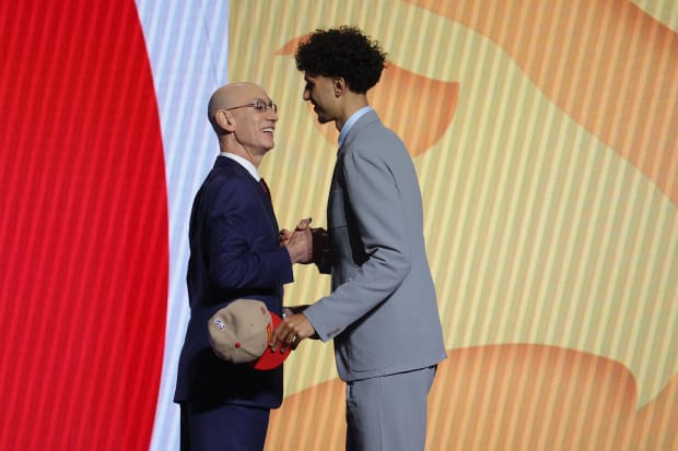 Zaccharie Risacher shakes hands with NBA commissioner Adam Silver after being selected first overall by the Atlanta Hawks.