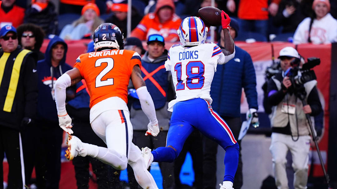 Jan 17, 2026; Denver, CO, USA; Buffalo Bills wide receiver Brandin Cooks (18) makes a catch against Denver Broncos cornerback Pat Surtain II (2) during the second quarter of an AFC Divisional Round playoff game at Empower Field at Mile High. Mandatory Credit: Ron Chenoy-Imagn Images