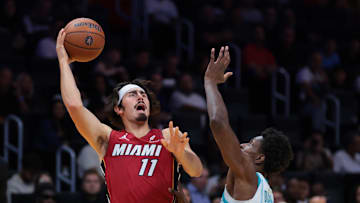 Nov 7, 2025; Miami, Florida, USA; Miami Heat forward Jaime Jaquez Jr. (11) shoots the ball over Charlotte Hornets forward Moussa Diabate (14) during the first quarter of an NBA Cup game at Kaseya Center. Mandatory Credit: Sam Navarro-Imagn Images