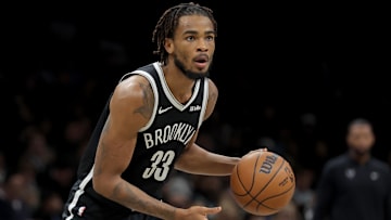 Dec 1, 2025; Brooklyn, New York, USA; Brooklyn Nets center Nic Claxton (33) controls the ball against the Charlotte Hornets during the third quarter at Barclays Center. Mandatory Credit: Brad Penner-Imagn Images