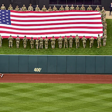 Apr 7, 2022; St. Louis, Missouri, USA;  Soldiers present the flag during the National Anthem in center field before Opening Day between the St. Louis Cardinals and the Pittsburgh Pirates at Busch Stadium. Mandatory Credit: Jeff Curry-Imagn Images