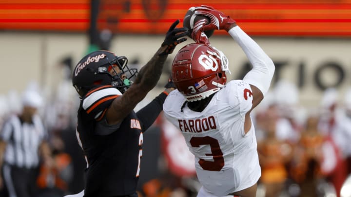 Nov 4, 2023; Stillwater, Oklahoma, USA; Oklahoma Sooners wide receiver Jalil Farooq (3) can't hang on to the ball beside Oklahoma State Cowboys cornerback Korie Black (2)  during a Bedlam college football game between the Oklahoma State University Cowboys (OSU) and the University of Oklahoma Sooners (OU) at Boone Pickens Stadium. Mandatory Credit: Bryan Terry-USA TODAY Sports