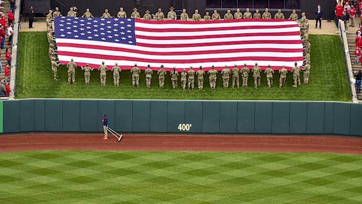 Apr 7, 2022; St. Louis, Missouri, USA;  Soldiers present the flag during the National Anthem in center field before Opening Day between the St. Louis Cardinals and the Pittsburgh Pirates at Busch Stadium. Mandatory Credit: Jeff Curry-Imagn Images