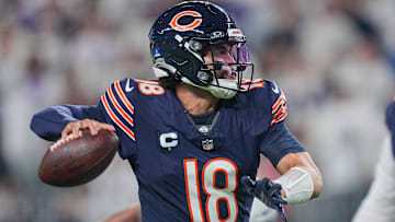 Dec 16, 2024; Minneapolis, Minnesota, USA; Chicago Bears quarterback Caleb Williams (18) passes against the Minnesota Vikings in the third quarter at U.S. Bank Stadium. Mandatory Credit: Brad Rempel-Imagn Images