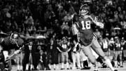 Ole Miss Rebels quarterback Archie Manning (18) looks for a receiver against Vanderbilt.