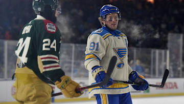 Jan 1, 2022; Minneapolis, MN, USA; Minnesota Wild defenseman Matt Dumba (24) and St. Louis Blues right wing Vladimir Tarasenko (91) in the third period of the 2022 Winter Classic ice hockey game at Target Field. Mandatory Credit: Jeffrey Becker-Imagn Images