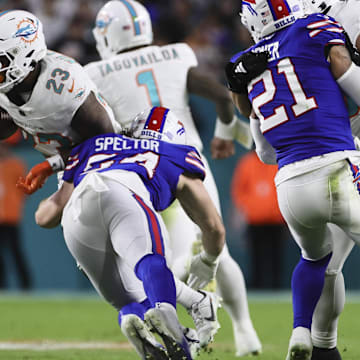 Jan 7, 2024; Miami Gardens, Florida, USA; Miami Dolphins running back Jeff Wilson Jr. (23) runs with the football as Buffalo Bills linebacker Baylon Spector (54) attempts a tackle during the second quarter at Hard Rock Stadium.