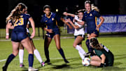St. Thomas Aquinas and Lakewood Ranch players scramble for a loose ball in front of the net before the ball is eventually gobbled up by the Lakewood goalkeeper. STA won the Class 6A state semifinal, 2-0, at Lake Myrtle Sports Complex on Thursday.