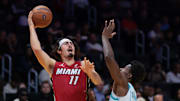 Nov 7, 2025; Miami, Florida, USA; Miami Heat forward Jaime Jaquez Jr. (11) shoots the ball over Charlotte Hornets forward Moussa Diabate (14) during the first quarter of an NBA Cup game at Kaseya Center. Mandatory Credit: Sam Navarro-Imagn Images