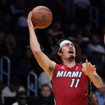 Nov 7, 2025; Miami, Florida, USA; Miami Heat forward Jaime Jaquez Jr. (11) shoots the ball over Charlotte Hornets forward Moussa Diabate (14) during the first quarter of an NBA Cup game at Kaseya Center. Mandatory Credit: Sam Navarro-Imagn Images