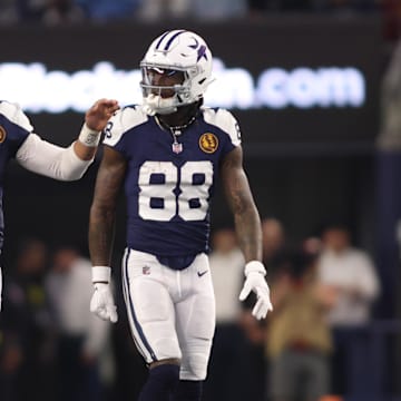 Dallas Cowboys wide receiver CeeDee Lamb and quarterback Dak Prescott talk during the game against the Washington Commanders.