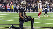 Sep 14, 2025; New Orleans, Louisiana, USA;  New Orleans Saints wide receiver Chris Olave (12) reacts to dropping a pass in the end zone against the San Francisco 49ers during the first half at Caesars Superdome. Mandatory Credit: Stephen Lew-Imagn Images