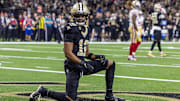 Sep 14, 2025; New Orleans, Louisiana, USA;  New Orleans Saints wide receiver Chris Olave (12) reacts to dropping a pass in the end zone against the San Francisco 49ers during the first half at Caesars Superdome. Mandatory Credit: Stephen Lew-Imagn Images