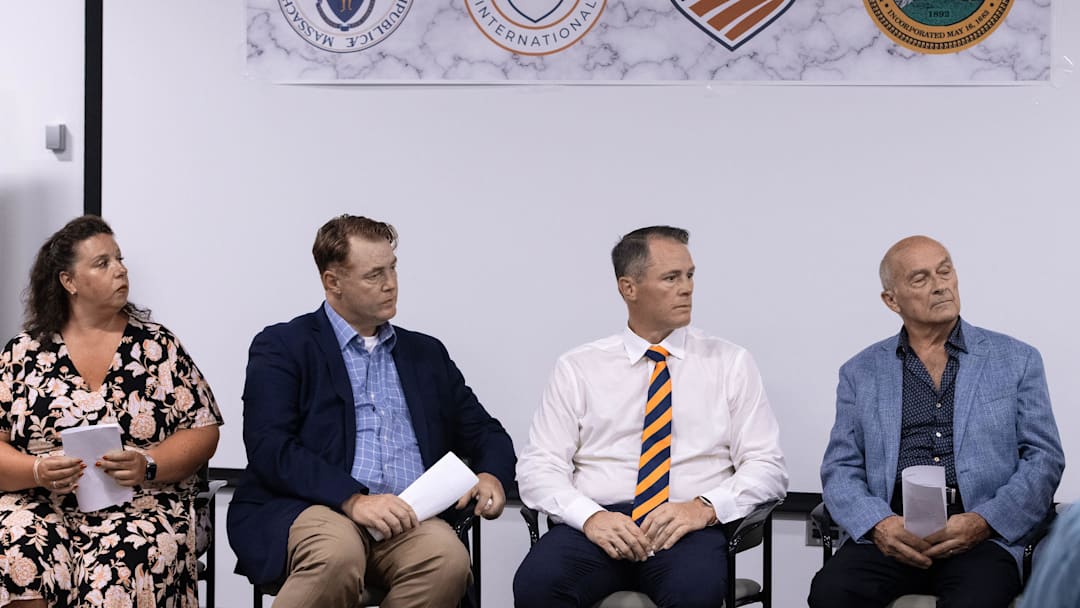 Town administrator Denise Dembowski, Peter Masters, Chris Masters and Richard Odell of Masters Academy International, listen to head of USA Fencing Phil Andrews, during the announcement that Masters Academy International (MAI) will redevelop the former Bose property on Great Road in Stow into a $83 million multi-use sports and education complex, July 31, 2025. Town administrator Denise Dembowski, Peter Masters, Chris Masters and Richard Odell of Masters Academy International, listen to head of USA Fencing Phil Andrews, during the announcement that Masters Academy International (MAI) will redevelop the former Bose property on Great Road in Stow into a $83 million multi-use sports and education complex, July 31, 2025.