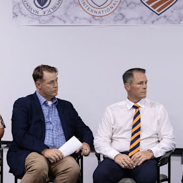 Town administrator Denise Dembowski, Peter Masters, Chris Masters and Richard Odell of Masters Academy International, listen to head of USA Fencing Phil Andrews, during the announcement that Masters Academy International (MAI) will redevelop the former Bose property on Great Road in Stow into a $83 million multi-use sports and education complex, July 31, 2025.