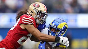 San Francisco 49ers safety Talanoa Hufanga (L) tackles Los Angeles Rams running back Kyren Williams (R)