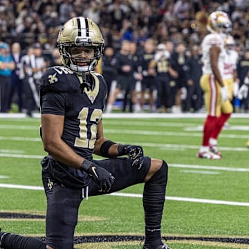 Sep 14, 2025; New Orleans, Louisiana, USA;  New Orleans Saints wide receiver Chris Olave (12) reacts to dropping a pass in the end zone against the San Francisco 49ers during the first half at Caesars Superdome. Mandatory Credit: Stephen Lew-Imagn Images