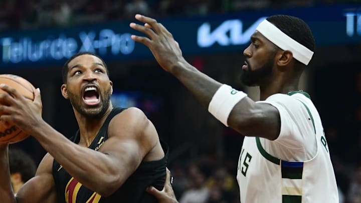 Dec 29, 2023; Cleveland, Ohio, USA; Cleveland Cavaliers center Tristan Thompson (12) drives to the basket against Milwaukee Bucks forward Bobby Portis (9) during the first half at Rocket Mortgage FieldHouse. 