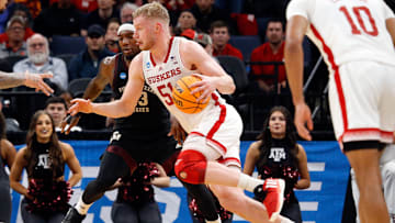 Mar 22, 2024; Memphis, TN, USA; Nebraska Cornhuskers forward Rienk Mast (51) drives to the basket as Texas A&M Aggies guard Tyrece Radford (23) defends during the first half in the NCAA Tournament First Round at FedExForum. Mandatory Credit: Petre Thomas-Imagn Images