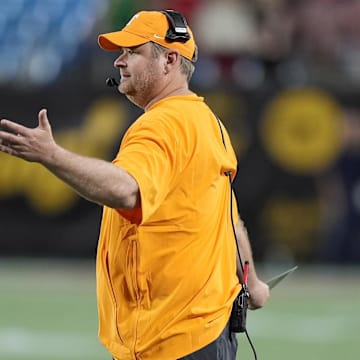 Sep 7, 2024; Charlotte, North Carolina, USA; Tennessee Volunteers head coach Josh Heupel questions a call by the officials during the second quarter against the North Carolina State Wolfpack at the Dukes Mayo Classic at Bank of America Stadium. Mandatory Credit: Jim Dedmon-Imagn Images