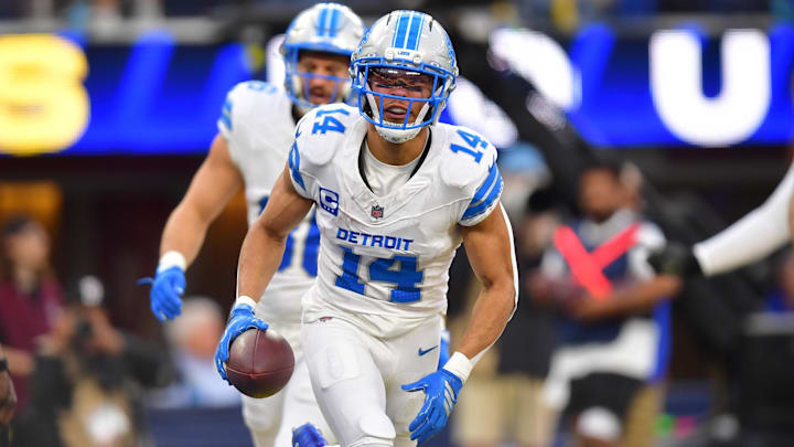 Dec 14, 2025; Inglewood, California, USA; Detroit Lions wide receiver Amon-Ra St. Brown (14) celebrates after a touchdown during the second quarter against the Los Angeles Rams at SoFi Stadium. Mandatory Credit: Gary A. Vasquez-Imagn Images