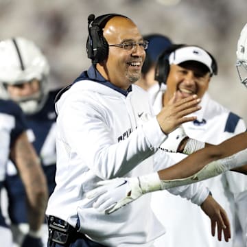 Penn State Nittany Lions head coach James Franklin celebrates with running back Nicholas Singleton during a Big Ten football game vs. the Minnesota Golden Gophers.