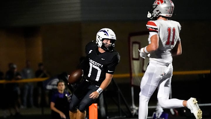 Iowa City Liberty’s Reece Rettig (17) scores a touchdown trailed by Iowa City High’s Blaine Heick (11) during a high school football game Oct. 17, 2025 in North Liberty, Iowa.