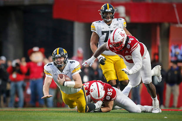 Iowa senior quarterback Nate Stanley is caught by Nebraska junior defensive end Ben Stille