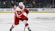 Feb 19, 2024; Seattle, Washington, USA; Detroit Red Wings right wing Daniel Sprong (17) shoots the puck against the Seattle Kraken during the first period at Climate Pledge Arena. Mandatory Credit: Joe Nicholson-USA TODAY Sports