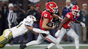 Georgia quarterback Carson Beck (15) runs the ball during the second half of a NCAA college football game against Georgia Tech in Atlanta, on Saturday, Nov. 25, 2023.Georgia won 31-23.