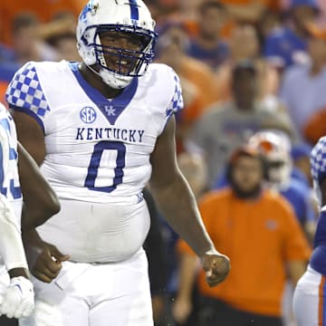 Sep 10, 2022; Gainesville, Florida, USA; Kentucky Wildcats defensive tackle Deone Walker (0) reacts after making a tackle against the Florida Gators during the second half at Ben Hill Griffin Stadium. Mandatory Credit: Kim Klement-Imagn Images