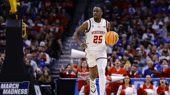 Mar 22, 2025; Denver, CO, USA; Wisconsin Badgers guard John Blackwell (25) dribbles the ball against the Brigham Young Cougars during the first half in the second round of the NCAA Tournament  at Ball Arena. Mandatory Credit: Isaiah J. Downing-Imagn Images