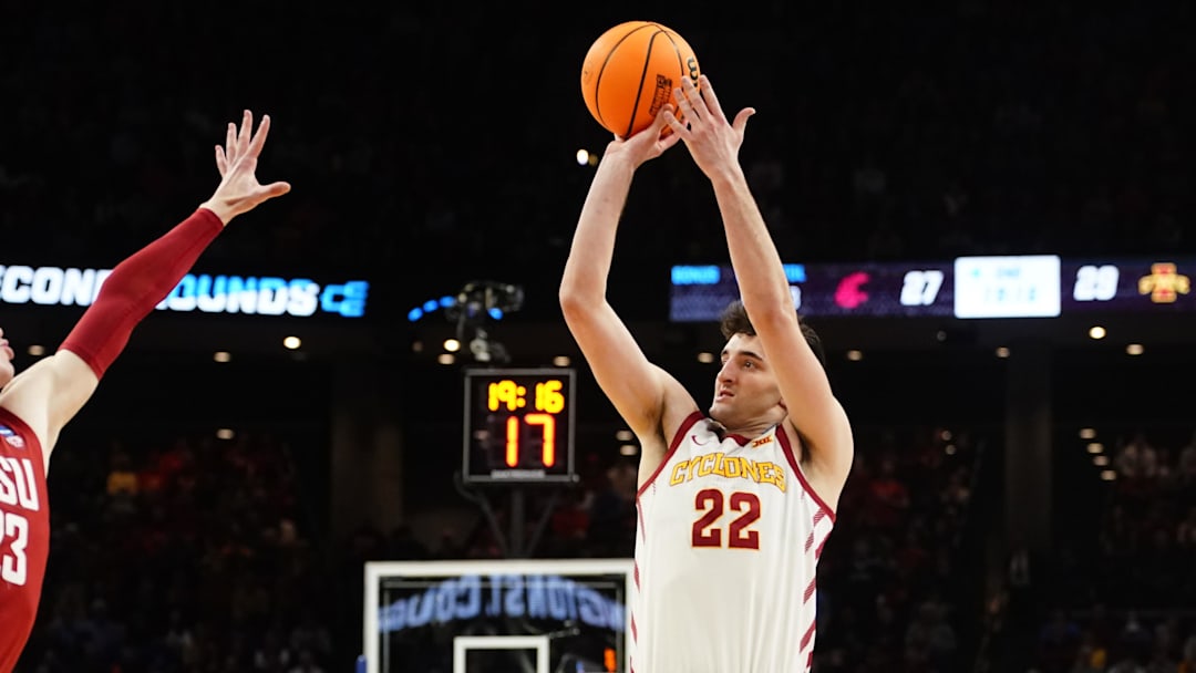 Mar 23, 2024; Omaha, NE, USA; Iowa State Cyclones forward Milan Momcilovic (22) shoots the ball against Washington State Cougars forward Andrej Jakimovski (23) during the second half in the second round of the 2024 NCAA Tournament at CHI Health Center Omaha. Mandatory Credit: Dylan Widger-Imagn Images