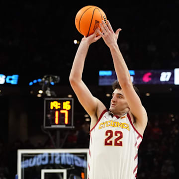 Mar 23, 2024; Omaha, NE, USA; Iowa State Cyclones forward Milan Momcilovic (22) shoots the ball against Washington State Cougars forward Andrej Jakimovski (23) during the second half in the second round of the 2024 NCAA Tournament at CHI Health Center Omaha. Mandatory Credit: Dylan Widger-Imagn Images