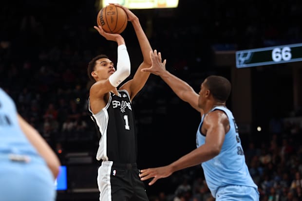 San Antonio Spurs center Victor Wembanyama (1) shoots as Memphis Grizzlies center Trey Jemison (55) defends. 