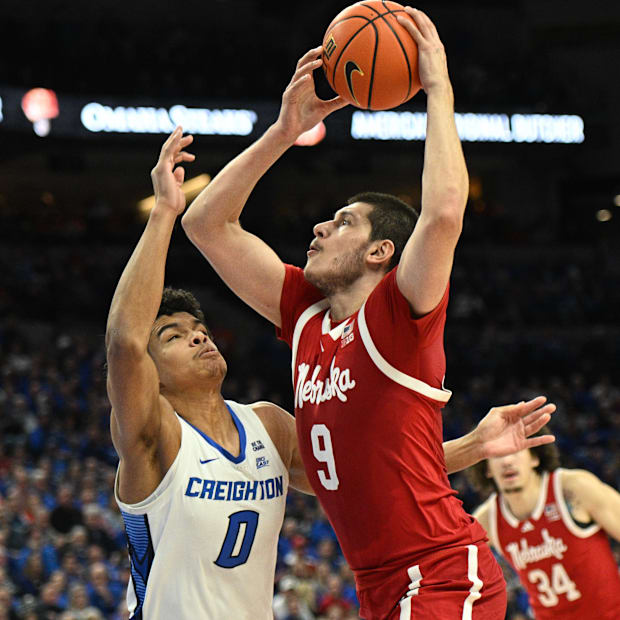 Nebraska forward Berke Buyuktuncel drives against Creighton forward Jasen Green on Nov. 22, 2024.