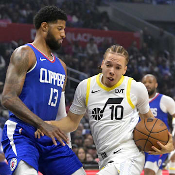 Apr 5, 2024; Los Angeles, California, USA; Utah Jazz guard Jason Preston (10) is defended by Los Angeles Clippers forward Paul George (13) in the first half at Crypto.com Arena. Mandatory Credit: Jayne Kamin-Oncea-Imagn Images